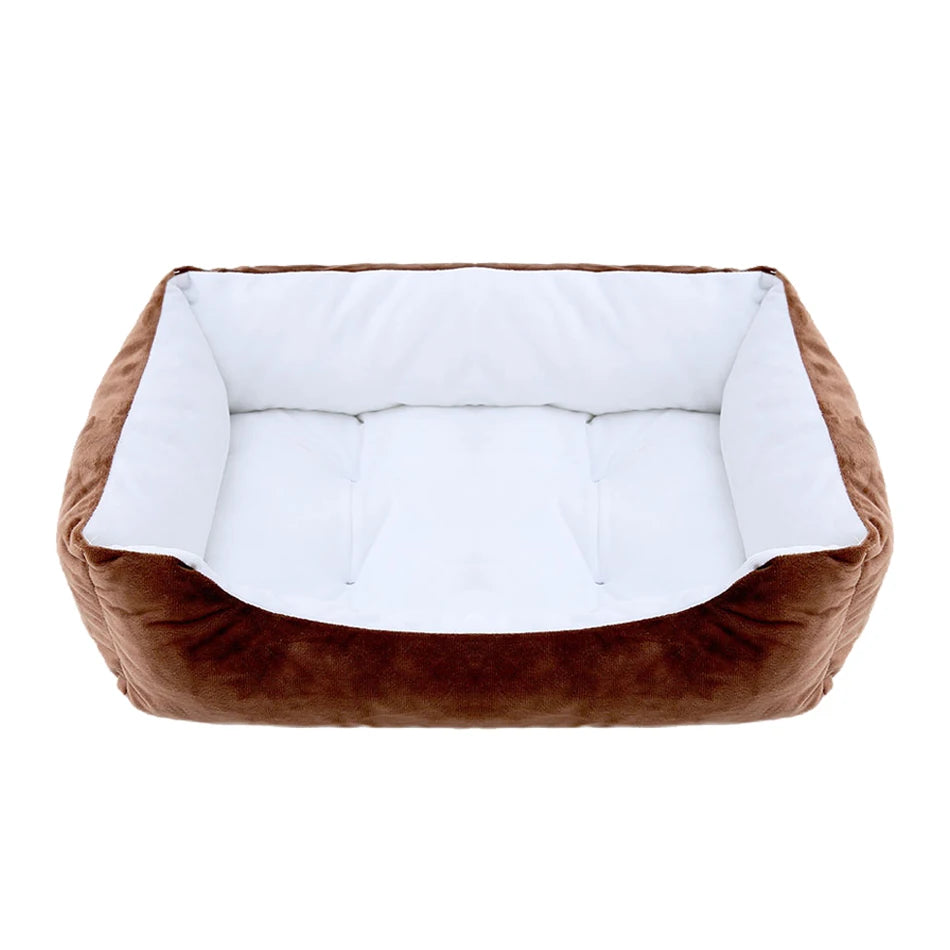 Brown pet bed with white cushion on a white background
