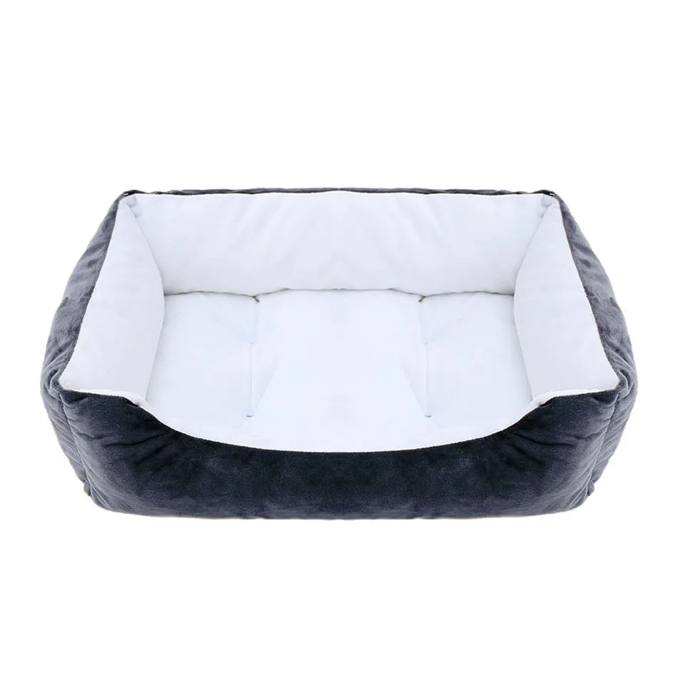 Gray pet bed with white cushion on a white background
