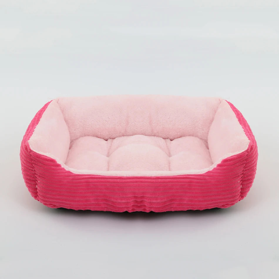 Pink and red pet bed on a light gray background