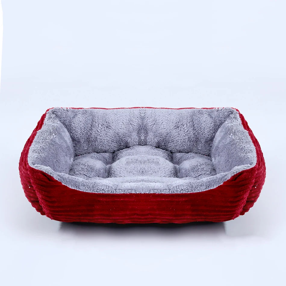 Red and gray pet bed on a white background