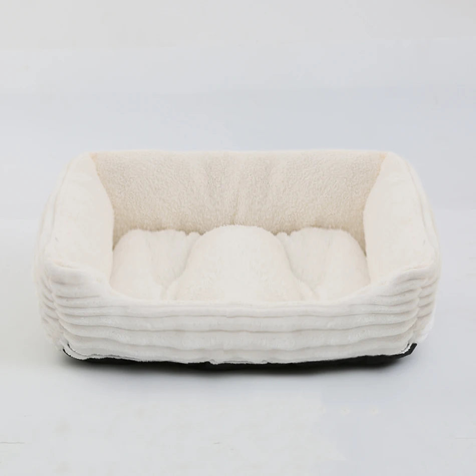 White pet bed with soft texture on a light gray background