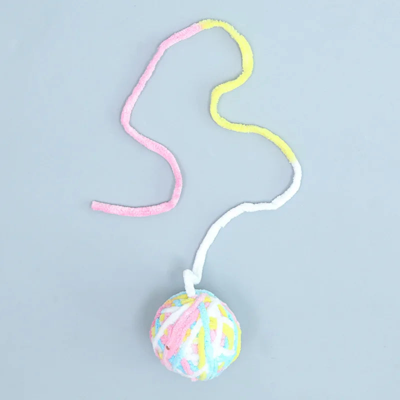 Colorful ball with a string on a light blue background