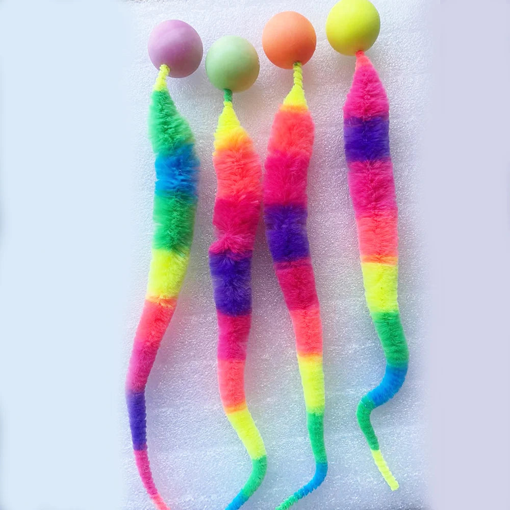 Colorful cat toy with yarn ends on a white background