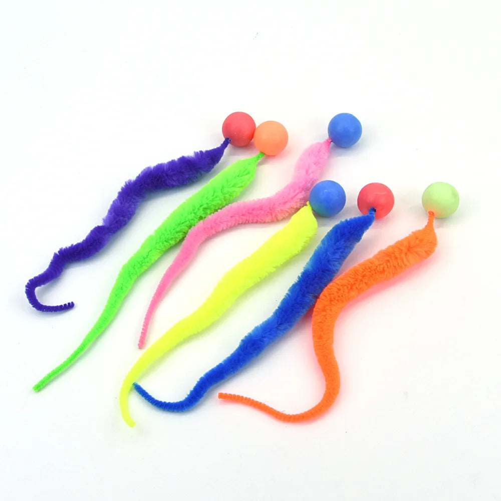 Colorful cat toys with long tails and ball ends on a white background
